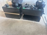 Both nightstands side by side showing missing drawers and surface wear