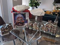 Group shot of boxed waterball, five village buildings, Santa hat-stocking