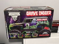 Front of retail box showing Grave Digger graphics and features