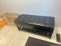 Bench and shoe rack side by side in entryway