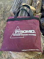 Maroon Pyromid storage bag with branding