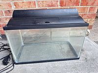 Front view of glass aquarium with hood attached