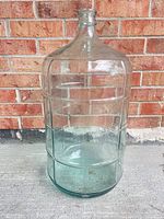 full view of glass carboy showing molded panel design