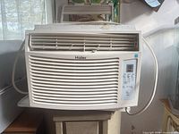 Front view of Haier window air conditioner showing grille, control panel and overall condition