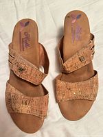 Top view of both sandals showing cork upper, straps and branding