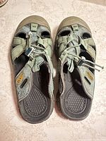 Top view of both sandals showing overall design and wear
