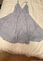 Front view of light blue jacquard mini dress laid flat