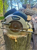 Front view of Mastercraft circular saw on stump showing blade and guard
