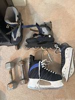 Inline skates, ice skates, two dumbbells on floor