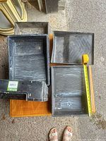 Top view of four trays showing size and condition