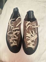 Top view of both Scarpa climbing shoes showing laces and branding