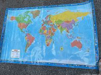 CCC bilingual world map with flags border shown laid flat