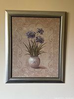 Full view of framed floral print showing artwork and frame