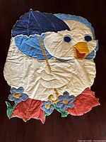 Full view of baby duck quilt showing entire design and dimensions context