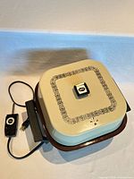 Skillet with cream lid, temperature control cord attached