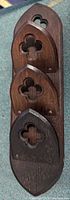 Front view of three-tier carved wood letter holder
