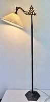 Full view of Art Deco bridge floor lamp illuminated