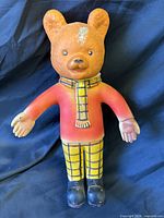 Front view of Rupert The Bear squeaky toy standing upright
