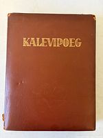Front cover showing brown leather and gilt title