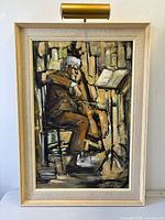 Frontal view of framed Julius Damasdy oil painting with picture light