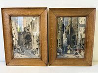 Both framed etchings side by side front view