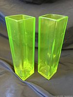 Front view of both rectangular green glass vases