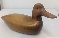 Left side view of carved wood duck decoy