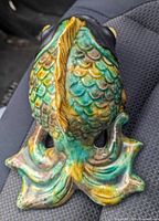Rear view of glazed ceramic koi fish wall pocket showing scale detail and tail opening
