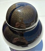 top view of lid highlighting aventurine flecks