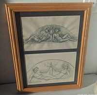 Full view of framed pair of pencil sketches in gold wood frame