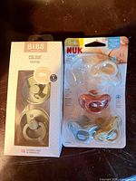 BIBS 2-pack pacifiers and NUK 3-pack pacifiers front packaging