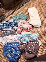 Cloth diapers and inserts on carpet