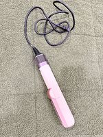 Full view of pink wet-to-dry straightener with cord