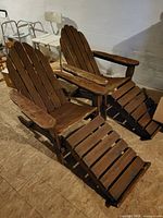 Front angled view of both chairs with ottomans attached