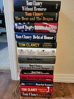 Stacked front view showing all 13 Tom Clancy hardcover titles