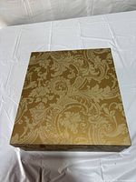 Closed decorative gold damask box
