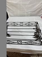 top view of rectangular wrought-iron pot rack on table