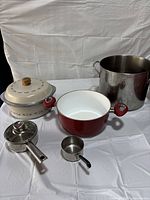 Group shot of all five cookware pieces showing sizes and finishes