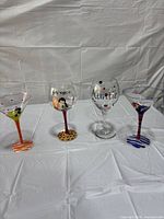 Four novelty glasses in a row