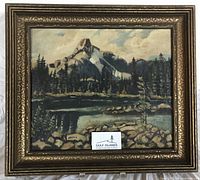 Front view of framed oil landscape painting