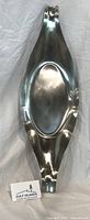Full view of elongated stainless steel platter front