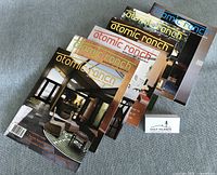 Five Atomic Ranch magazines fanned out showing assorted covers