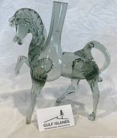 Full left-side view of glass stallion vase