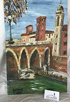 Full view of unframed acrylic painting showing bridge and buildings