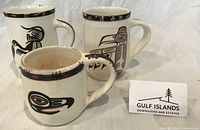 Three Lambert Potteries mugs with Haida designs