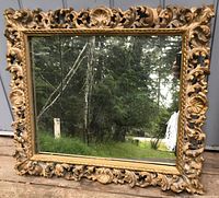Front view of carved gilt Rococo style mirror