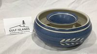 Top view of blue stoneware bud vase with nested central cup