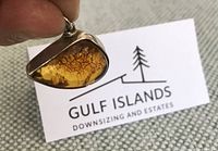 Front view of amber pendant showing bezel and bail