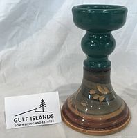 Full view of glazed studio pottery candlestick holder upright