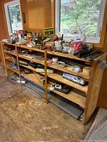 overall view of shelving unit and assorted tools and hardware